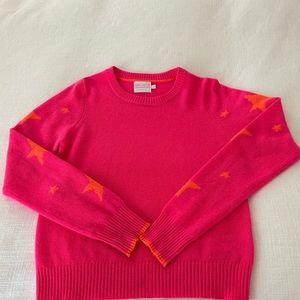 Brodie Cashmere pink cashmere sweater with orange stars on sleeves.Size S